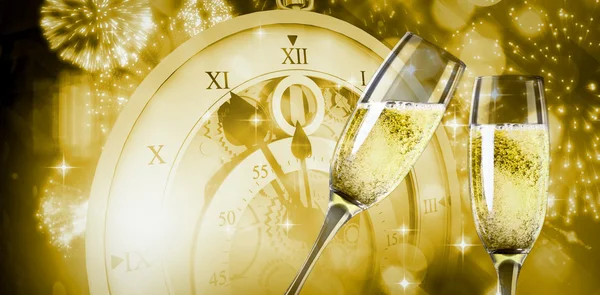 Composite image of champagne glasses clinking — Stock Photo, Image