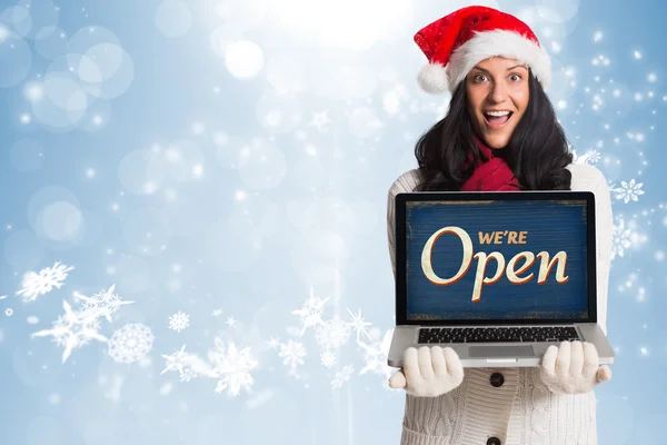 Smiling woman holding a laptop — Stock Photo, Image