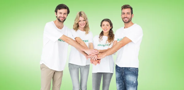 Group portrait of happy volunteers with hands — Stock Photo, Image