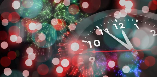 Clock against colourful fireworks — Stock Photo, Image