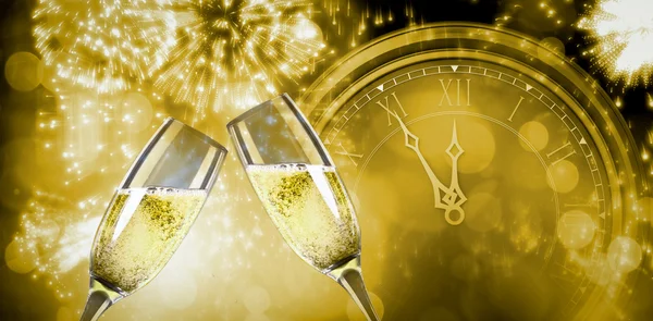 Composite image of champagne glasses clinking — Stock Photo, Image