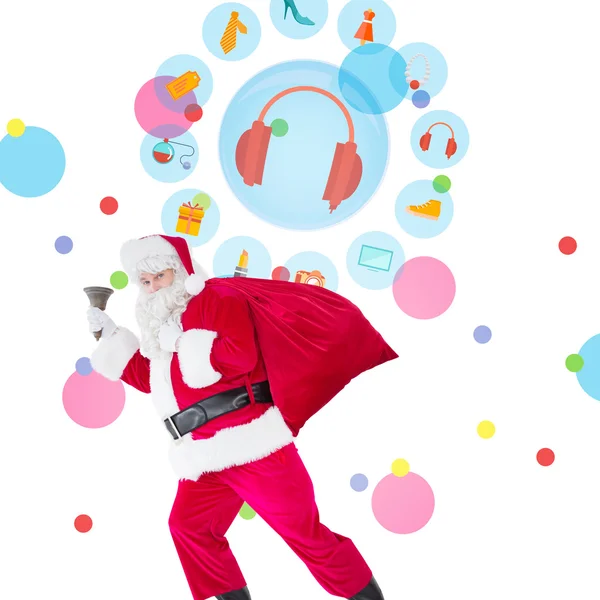 Santa walking with his sack and bell — Stock Photo, Image