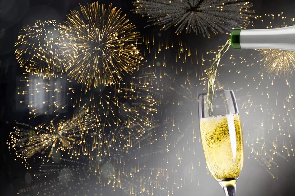 Composite image of champagne pouring — Stock Photo, Image