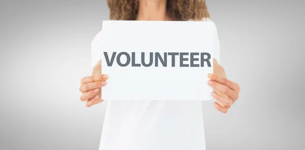 Voluntário mostrando um cartaz — Fotografia de Stock