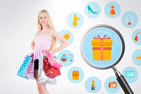 Blonde holding shopping bags — Stock Photo, Image