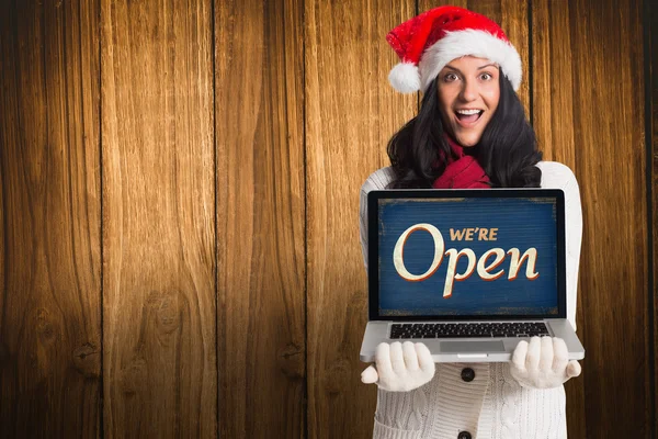 Smiling woman holding a laptop — Stock Photo, Image