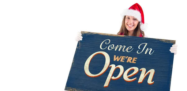 Festive blonde showing banner — Stock Photo, Image