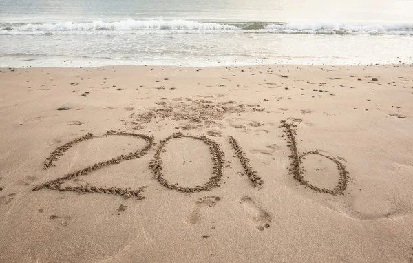 2016 on sand at beach — Stock Photo, Image