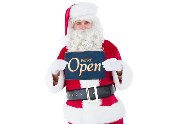 Sourire santa claus holding page — Photo