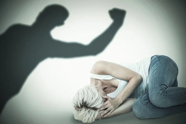 Sad blonde lying on floor — Stock Photo, Image