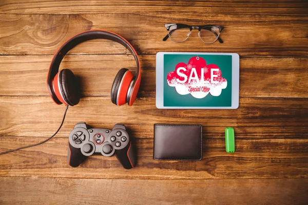 Sale advertisement against tablet — Stock Photo, Image