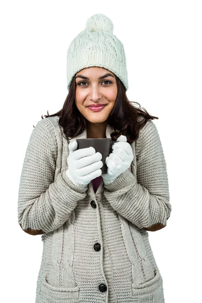 Festive brunette holding hot drink — Stock Photo, Image