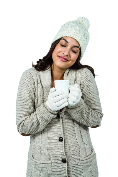 Festive brunette holding hot drink — Stock Photo, Image