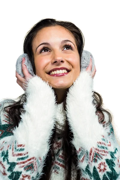 Woman with earmuffs looking up — Stock Photo, Image