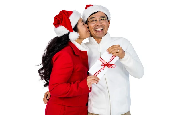 Festive senior couple holding gift — Stock Photo, Image