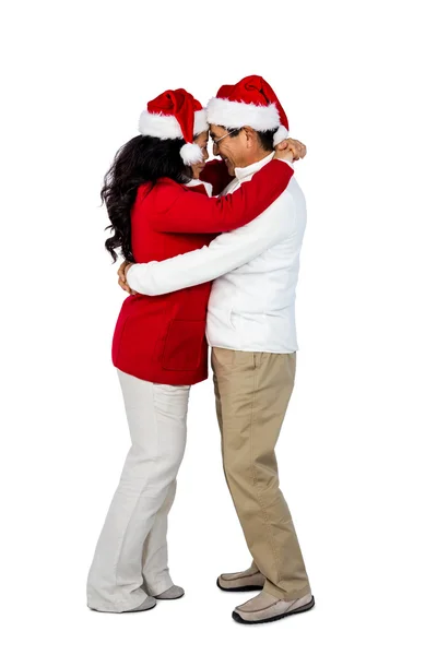 Festive senior couple hugging Stock Picture