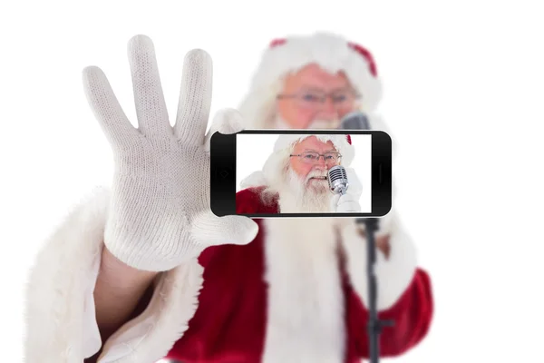 Santa gospodarstwa telefon komórkowy — Zdjęcie stockowe