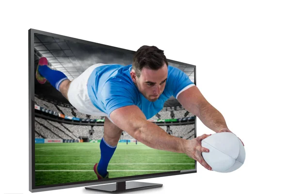 Composite image of american football player trying to catch foot — Stock Photo, Image