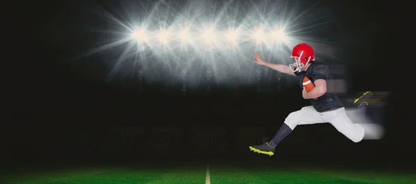 American football player jumping — Stock Photo, Image