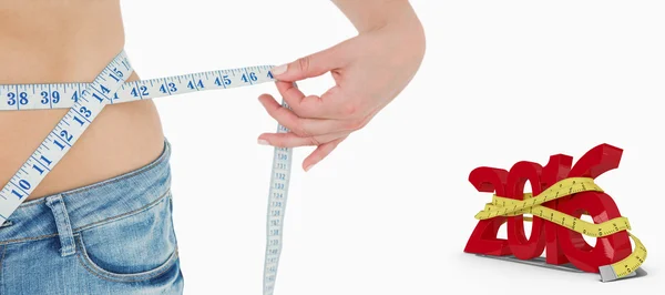 Woman measuring her waist — Stock Photo, Image