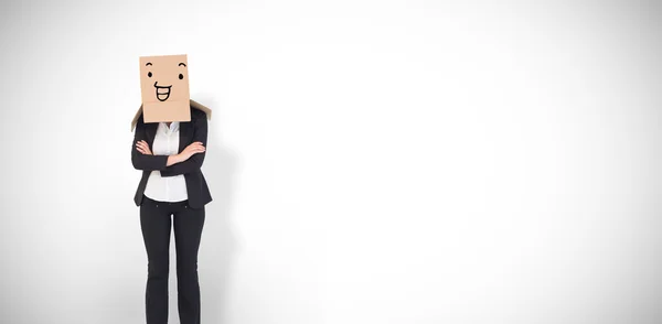 Businesswoman with box over head — Stock Photo, Image