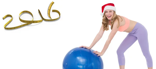 Festive woman using exercise ball — Stock Photo, Image