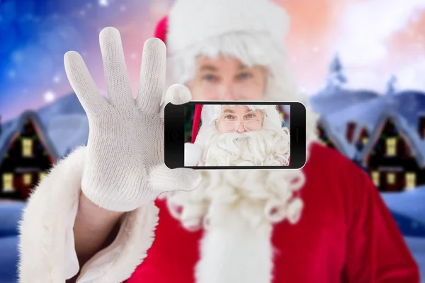 Santa holding cep telefonu — Stok fotoğraf