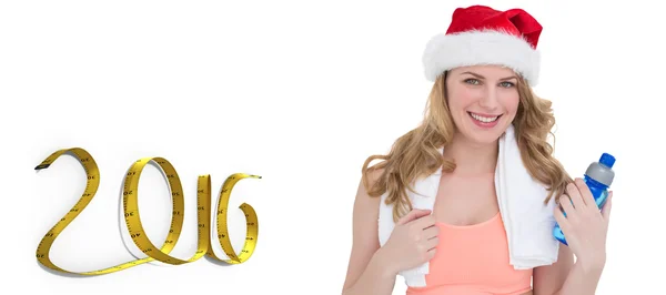 Festive fit blonde holding bottle — Stock Photo, Image