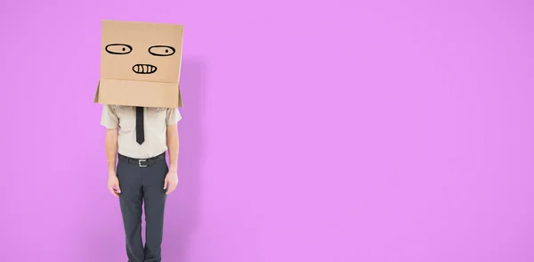 Businessman standing with box on head — Stock Photo, Image