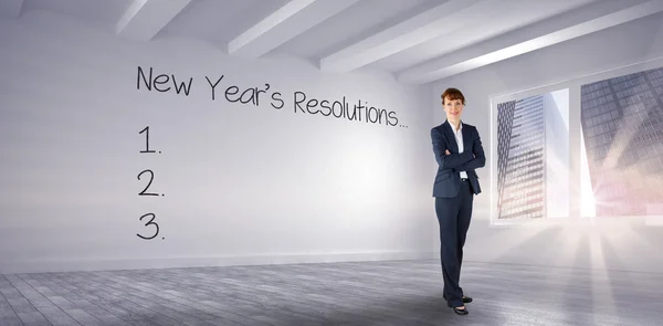 Smiling businesswoman against big room — Stock Photo, Image