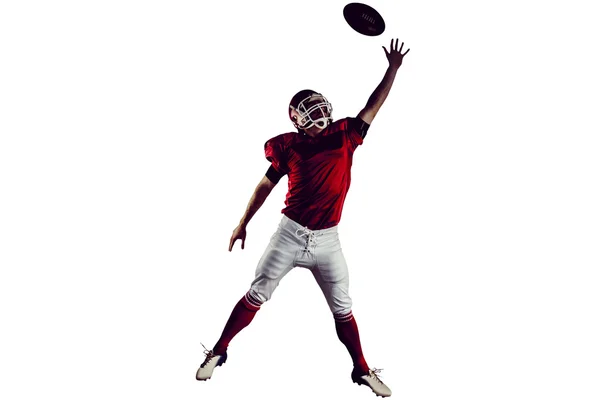 American football player trying to catch football — Stock Photo, Image