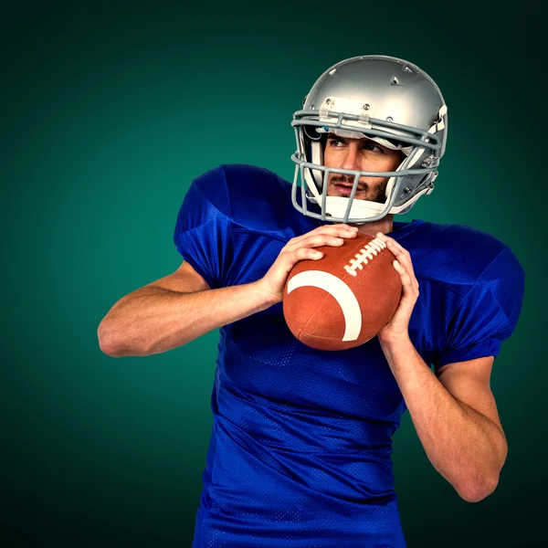 Amerikai labdarúgó holding ball — Stock Fotó