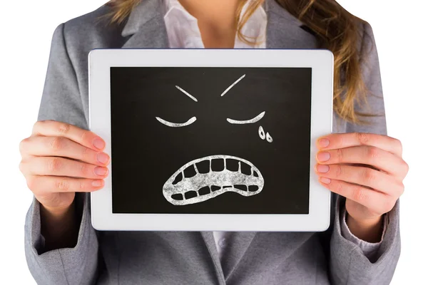 Composite image of businesswoman showing tablet — Stock Photo, Image