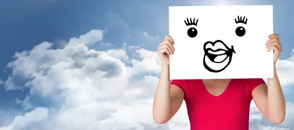 Woman in pink t-shirt showing card — Stock Photo, Image