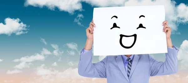 Businessman hiding his face behind a blank panel — Stock Photo, Image