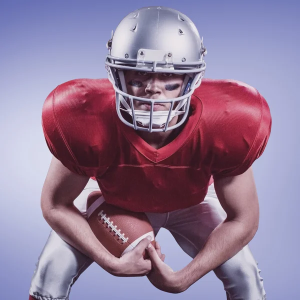 American football player holding ball — Stock Photo © Wavebreakmedia