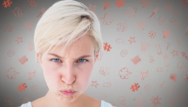 Composite image of angry woman looking at camera — Stock Photo, Image