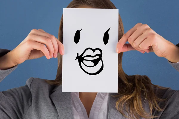 Composite image of businesswoman showing a card — Stock Photo, Image