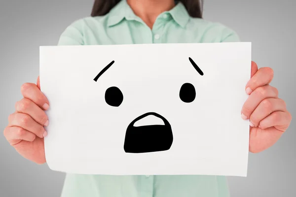 Composite image of brunette showing sign — Stock Photo, Image