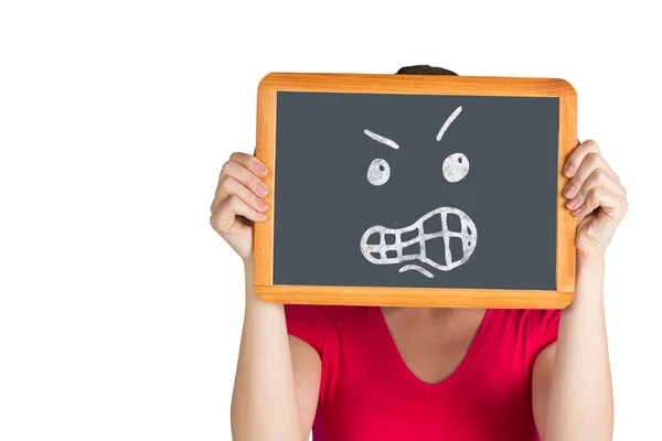 Woman holding chalkboard over face — Stock Photo, Image