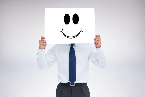 Tradesman holding blank sign in front of his head — Stock Photo, Image