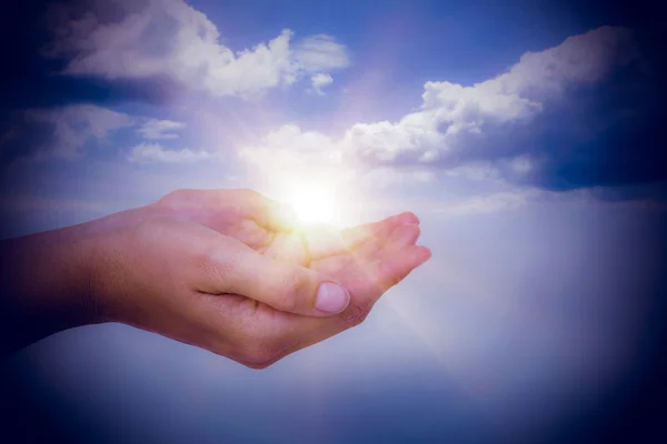 Hands presenting against sky — Stock Photo, Image