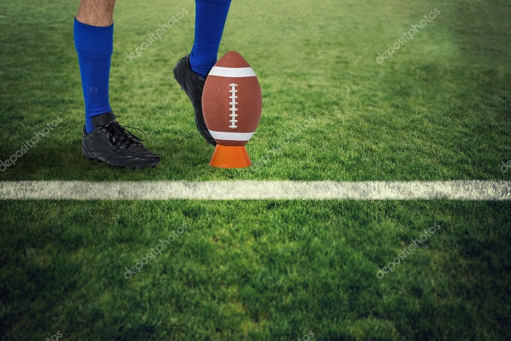 American football player kicking ball Stock Photo by ©Wavebreakmedia