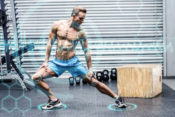 Muskulös man gör benet stretchings — Stockfoto
