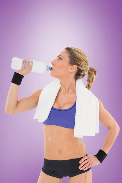 Strong blonde drinking from water bottle — Stock Photo, Image