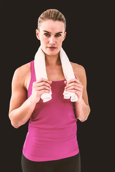 Muscular woman holding a towel — Stock Photo, Image