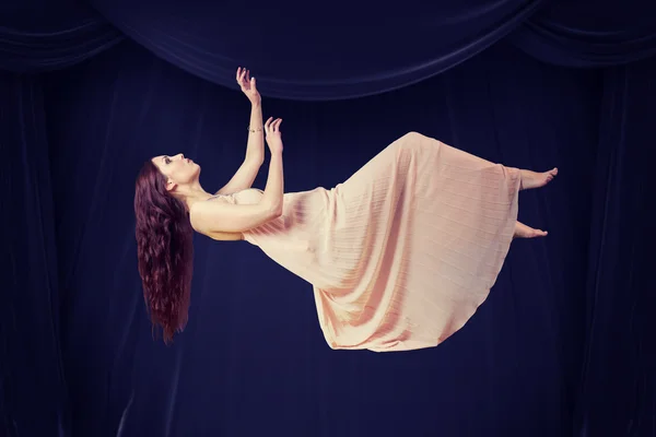 Full length of woman flying — Stock Photo, Image