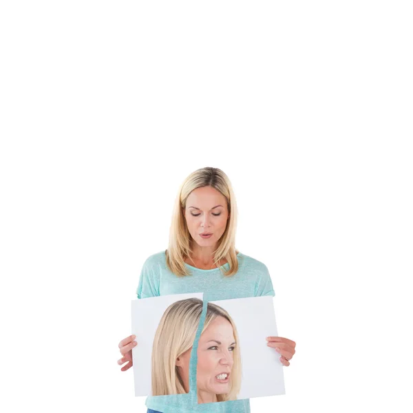 Woman ripping picture of herself — Stock Photo, Image