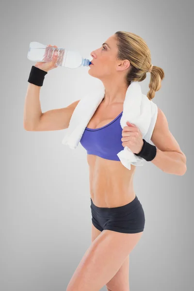 Strong blonde drinking from water bottle — Stock Photo, Image