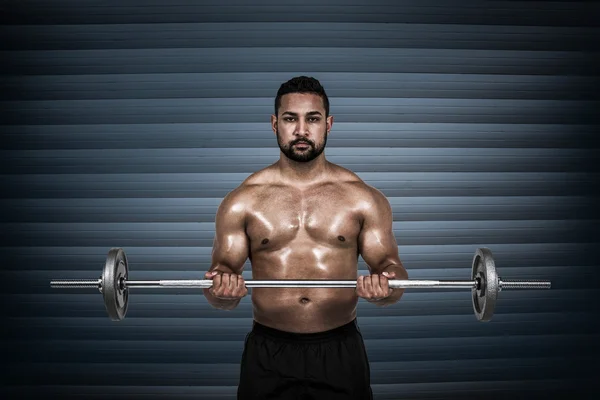 Muscular hombre levantando pesado barbell —  Fotos de Stock